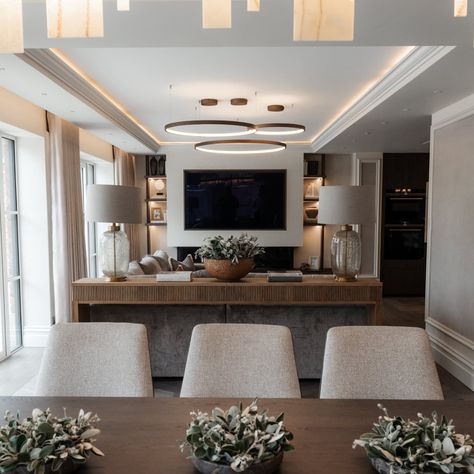 The open plan living area at project Shire Lodge. This space was long and narrow, but by zoning out the ceiling and mirroring that with the flooring borders, it gave each space its own entity. Softly dividing the spaces with a bespoke console and two large lamps, this makes the spaces feel individual, yet still harmonious. #openplanliving #openplan #openplankitchen Large Lamps, The Ceiling, Open Plan Kitchen, Open Plan Living, Open Plan, Living Area, Borders, Bespoke, Divider