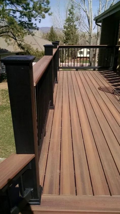 Discover the benefits and considerations of composite decking for your home. This comprehensive guide provides homeowners with valuable information on safety, eco-friendliness, and maintenance. Two Tone Decks Ideas, Composite Deck With Wood Railing, Deck Patio Furniture Ideas, Timber Tech Deck Colors, Rustic Deck Ideas, Black Decking Ideas, Decking Colours Ideas, Timbertech Deck Ideas, Two Tone Deck