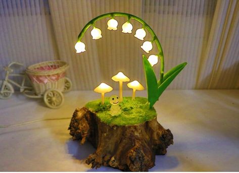 Lily of the Valley Mushroom Lamp Purely handmade, original design, the base is made of old wooden piles, which is naturally retro, reliable and environmentally friendly. This power supply method is designed for dual use of battery and USB. It can be used freely. If available, it can be directly powered by USB. It needs to be lit for a long time at night. It can also be powered by three AAA batteries while camping in the wild. Lily of the Valley is made of high-quality milky white glass with high Cool Room Decor Items, Wild Lily, Retro Night, Lamp Makeover, Handmade Lamp, Retro Lamp, Mushroom Lamp, Aaa Batteries, Milky White