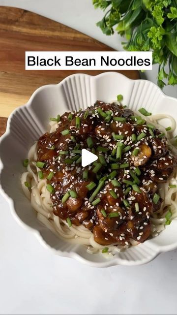 Lee Kum Kee India on Instagram: "Korean Black Bean Noodles (Jjajangmyeon) Ingredients: • 1 tablespoon oil • 1 cup chopped mushrooms • 1 onion, finely chopped • 2-3 spring onions, chopped (white and green parts separated) • 3-4 tablespoons LeeKumKee spicy black bean sauce • 1 tablespoon cornstarch mixed with 2 tablespoons water (slurry) • Udon noodles, cooked according to package instructions Method: Heat oil in a pan over medium heat. Add chopped mushrooms and cook until they release their moisture and become tender. Add chopped onion and sauté until translucent. Add the LeeKumKee spicy black bean sauce to the pan. Stir well to combine with the vegetables. Adjust the quantity according to your spice preference. Pour in the cornstarch slurry slowly, stirring continuously. This w Black Bean Noodles, Bean Noodles, Cornstarch Slurry, Instagram Korean, Bean Sauce, Black Bean Sauce, Udon Noodles, Spring Onions, Spring Onion