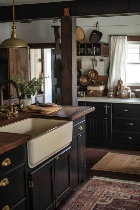 rustic black moody farmhouse kitchen Antique Modern Farmhouse, Farmhouse Black Cabinets, Cozy Kitchen Black Cabinets, Farmhouse Kitchen Black Appliances, Moody Kitchen With Oak Cabinets, Moody English Kitchen, Moody Vintage Farmhouse, Rustic Kitchen With Black Countertops, Rustic Black And White Kitchen