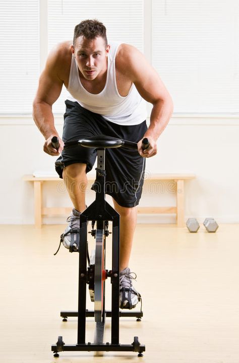 Man riding stationary bicycle in health club. Man riding a stationary bicycle in , #AFF, #stationary, #riding, #Man, #club, #health #ad Stationary Bicycle, Health Club, Graphics Design, Design Branding, Stationary Bike, Photo Image, Royalty Free Stock Photos, Bicycle, Resolution