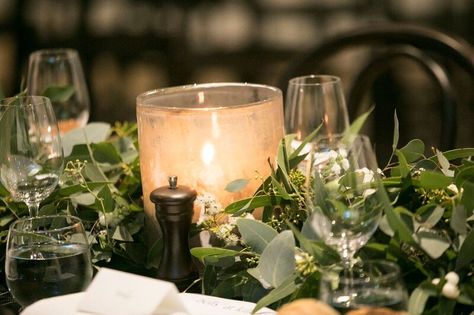 Warm candlelight amongst the gum leaf table runner #tablerunner #floral #green #eucalyptus #gumleaves #candle #hurricanevotive PC: @nadinesaacksphotography Flowers + Styling: @kurtzyflowers Gum Leaf Table Decorations, Eucalyptus Table Runner, Red Eucalyptus, Leaf Table Runner, Green Eucalyptus, Wedding Decor Style, Wedding Pins, Leaf Table, Ladies Night