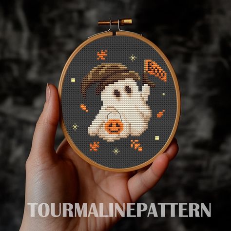 🎃👻 It’s that time of year again, when the little ghosts and ghouls come out to play! This ghost is here to make your Halloween a little more magical! ✨🍂 This small pattern is now available on Etsy. It’s perfect for a quick project (link in bio) #tourmalinepattern #crossstitchpattern #crossstitch #embroidery #pumpkincrossstitch #cozyplace #halloweenvibes #halloweenembroidery #garden #xstitch #xstitchpattern #funnycrossstitch #funnyembroidery #cottagecore #farmhouse #witchyembroidery #Autum... Witch Hat Cross Stitch Pattern, Cozy Cross Stitch, Halloween Cross Stitch Patterns Free, Free Halloween Cross Stitch Patterns, Ghosts Embroidery, Cross Stitch Witch, Perler Halloween, Cross Stitch Pumpkin, Ghost Cross Stitch