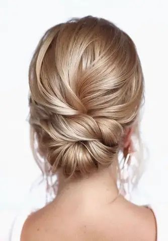 26 Wedding Updos Hairstyle Ideas [2024 Guide & Faqs] - Shop Smart Guides Wedding Updo Styles, Knotted Low Bun, Formal Hair Updo Elegant, Blonde Updo Hairstyles, Wedding Hair Up Do, Updos For Thick Hair, Sleek Bun Updo, Low Wedding Updo, Low Updo Wedding Hair