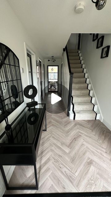 Nicola - The Monochrome Manor on Instagram: "H A L L W A Y   My favourite transformation, our hallway!   Carpet & flooring - Carpet Connection (Ordered/fitted) Carpet - Primo Grande in almond mousse by  STS Flooring  LVT Flooring - Inspiration in English Oak Grey Beige, Tarkett Glass door - Leader Doors Ceiling light - B&Q Prints - The House Outfit Black paint (doors & banister) - Loof, Frenchic  #bellway #bellwayhomes #bellwaynewbuild #bellwayhomesnewbuild #bellwayhome #newhouse #newhome #newbuildhome #housebuilding #house #homeaccounts #homeaccountuk #homeaccount  #diyinteriordecorating #diyhomedecor #homesofinsta #newbuildjourney #realhomesofinstagram #housetohome #neutraldecor #monochromedecor #monochromehome #monochromehomes #herringbonefloor #carpetrunner #hallway #hallwayinspo #mono Landing Flooring Upstairs, Monochrome Stairs And Landing, Black And Grey Hallway Ideas, Hallway Floor Ideas, Beige And Black Hallway, Black And Beige Hallway, Grey Carpet Stairs, Hallway Carpet Ideas, Hallway Flooring Ideas