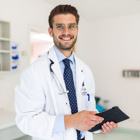 Portrait of a happy young doctor in his clinic Control Emotions, Doctor Images, Doctor Consultation, Rivaldo, Male Doctor, Doctor Picture, Pediatric Dentist, Primary Care Physician, Business Portrait