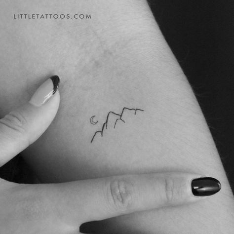 Set of three minimalist mountain and tiny crescent moon temporary tattoos. Dusk or dawn, the mountains are a magical place. They generate a sense of wonder and a number of spiritual experiences. In fact, being in the mountains takes you away from the hustle and bustle of everyday life and closer to the peace and quiet in the heavens. If you’re a nature lover who is and always will be in awe of the majesty of the mountains then our mountain temporary tattoo is the perfect piece for you. Created u Mini Tattoos Mountain, Tiny Tattoo Mountain, Mountains And Moon Tattoo, Three Sisters Mountain Tattoo, Nature Minimalist Tattoo, Mountain Tattoo Fine Line, Mountain Tattoo Ankle, Line Mountain Tattoo, Mini Mountain Tattoo