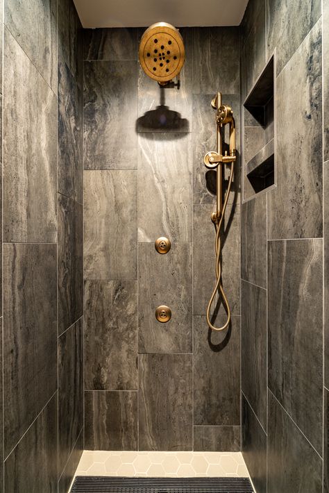 Seattle Master Bath Remodel. Brass plumbing fixtures along with porcelain 12x24 tile in a dark slate color make a statement in the walk-in shower. Dark Walk In Shower Ideas, Slate Master Bath, Masculine Shower Tile, Industrial Shower Fixtures, Slate Shower Ideas, Dark Shower Tile, Slate Tile Shower Walk In, Dark Gray Shower Tile, Dark Tile Shower Ideas