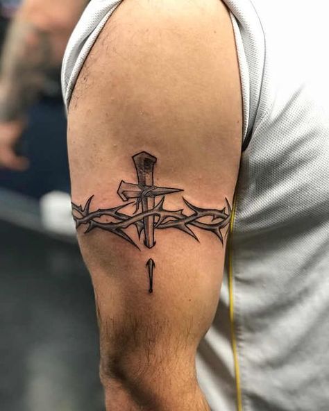 Learn the surprising barbed wire tattoo meaning before you get it on a body. As a bonus, we've added more than 60 unusual ideas for inspiration. Thorn Tattoo Men, Men Cross Tattoos, Christian Tattoos Men, Back Tattoos For Guys Upper, Barbed Wire Tattoo, Men's Tattoo, Wire Tattoo, Thorn Tattoo, Barbed Wire Tattoos