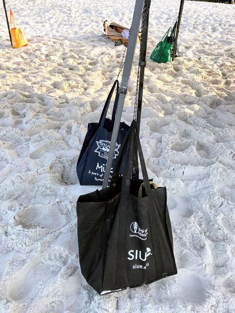 Beach hacks for keeping your beach canopy from blowing away in the wind - fill cheap shopping bags with sand and attach to the poles for added weight and stability. #beachhacks Camping Canopy Hacks, Diy Canopy Weights Tent, Diy Sand Bags Weights, Diy Beach Canopy, Diy Canopy Weights, Beach Umbrella Hack, Canopy Weights Diy Ideas, Beach Canopy Ideas, Beach Shade Ideas