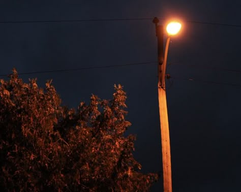 a streetlight at night Small Town Vampire Aesthetic, Indie Nostalgia Aesthetic, Midwest Neighborhood Aesthetic, Small Town Cryptid Aesthetic, Mysterious Town Aesthetic, 70s Small Town Aesthetic, 90s Town Aesthetic, 90s Midwest Aesthetic, Spooky Small Town Aesthetic