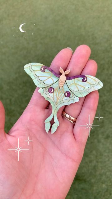 Louisa Camille on Instagram: "Luna Moon Moth in the most divine swirly pistachio green ✨  She’s fluttering into the Peppy shop for pre order this Friday the 2nd at 8pm AEST✨  #lunamoth #moth #moonmoth #lunamothbrooch #witchmoth #greenwitch #makersmovement #makersgonnamake #acrylicjewelry #lasercutacrylic #lasercutjewelry #lasercutjewellery #statementbrooch #brooch #peppychapette #louisacamille #broochaddict #broochmaker #broochoftheday #handmade #witchythings" Moon Moth, Luna Moon, Laser Cut Jewelry, Luna Moth, Pistachio Green, Acrylic Jewellery, Green Witch, Laser Cut Acrylic, Pistachio