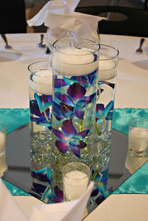 Blue orchids Centerpieces With Roses, Orchid Wedding Centerpieces, Coral Wedding Centerpieces, Blue Orchid Centerpieces, Orchids Centerpiece, Galaxy Orchid Centerpieces Wedding, Orchid Centerpieces Wedding, Blue Orchid Wedding, Purple Wedding Tables