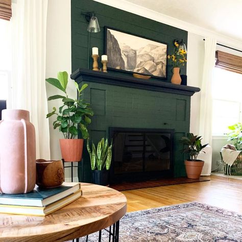 25 Dramatic And Colorful Painted Fireplace Ideas You Will Love Painting Fireplace Wall, Painted Plaster Fireplace, Eclectic Living Room With Fireplace, Dark Fireplace Light Walls, Hunter Green Fireplace, Painted Fireplace Mantles, Green Mantel Fireplace, Fireplace With Dark Floors, Painted Shiplap Fireplace Wall