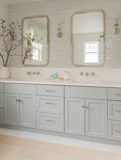 A light gray dual washstand adorned with satin nickel hardware is topped with a white quartz countertop holding sinks beneath satin nickel faucets fixed to a white quartz backsplash. Light Grey Backsplash, Light Grey Bathrooms, Quartz Backsplash, New House Bathroom, Grey Backsplash, Grey Bathroom Vanity, Transitional Bathroom, Master Bath Remodel, Upstairs Bathrooms