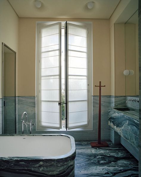 Lias stone defines the bath. Dornbracht tub filler. C. 1925 Jean-Michel Frank coatrack. Pierre Yovanovitch, Daybed Design, Paris Home, Oak Shelves, Oak Panels, Marble Flooring, Bathroom Color, Parisian Apartment, Paris Apartments