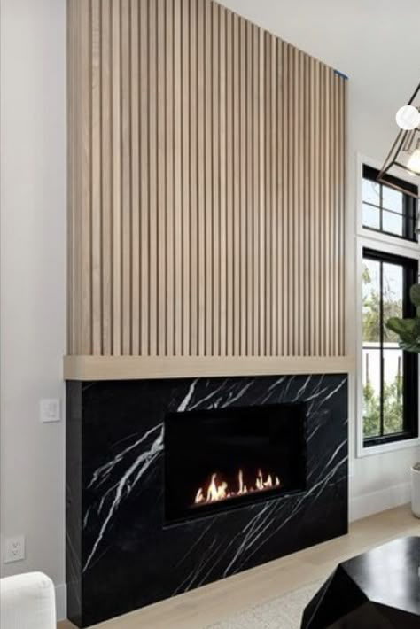 Fireplace With Bar On Side, Dark Fireplace Light Walls, Ribbon Tile Fireplace, Fluted Wood Fireplace Wall, Vertical Wood Fireplace, Pole Wrap Fireplace, Mid Century Fireplace Ideas, Two Tone Fireplace, Slat Fireplace