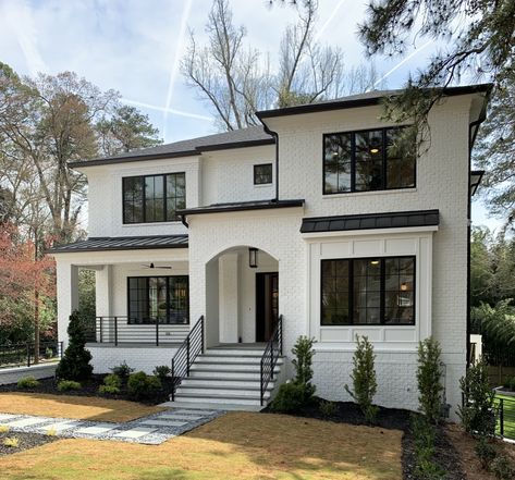 Black House White Stone Exterior, White House With Black Brick Foundation, Beige House With Black Windows, White Painted Brick Exterior Black Trim, Black And White Colonial Exterior, White Brick Modern House, White Brick House Exterior Black Windows, White Brick Black Windows, White House White Windows