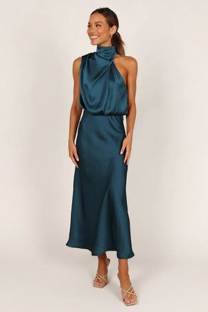 Here’s an example of a non-floor length gown that’s still appropriate for formal or black-tie occasions. This high-neck halter dress has a soft satin feel that translates as dressy, and the asymmetric high round neckline adds such a fun shape. The darker color also helps make this dress a formal option. Halter Neck Midi Dress, Petal And Pup, Halter Neck Maxi Dress, Usa Dresses, Satin Maxi, Satin Maxi Dress, Satin Midi Dress, Dresses By Length, Event Dresses