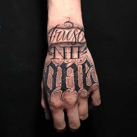 Hand Tattoo Text Men, Trust No One Tattoo Design Fonts, Struggle Tattoo, Chicano Letters, Trust No One Tattoo, Chest Tattoo Lettering, Tattoo Ideas Back, Red Heart Tattoos, One Tattoo