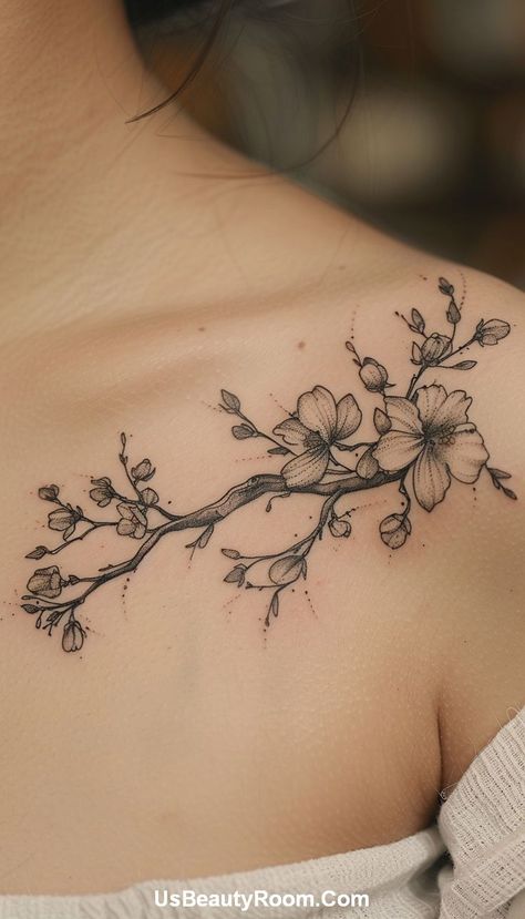 A black ink collarbone tattoo of a floral branch, featuring detailed line work and delicate flowers, creating a graceful and natural design. Small Collarbone Tattoo, Best Spine Tattoos, Collarbone Tattoo Ideas, Girl Spine Tattoos, Collarbone Tattoos, Symmetrical Tattoo, Small Neck Tattoos, Spine Tattoo Ideas, Tattoos For Men And Women