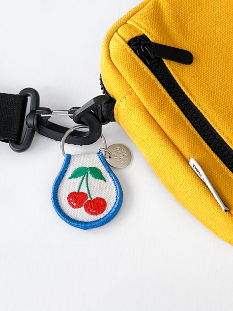 Show your keys some love with a Three Potato Four patch keychain! Retro Cherries inspired. Embroidered natural cotton patch keychain with double-sided embroidery and a metal split keyring. 2.5" x 1.8" Puff Stitch Strawberry Keychain, Embroider Keychain, Retro Keychain, Cherry Keychain, Personalized Keychain Embroidery, Groovy Keychain, Keychain Design, Great Christmas Gifts, Natural Cotton