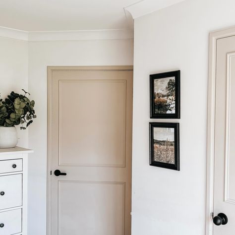 Painting our old interior doors has been such a great update to our home. The beige colour is soft but striking agains the white walls.  #interiordoors #beigepaint #homeDIY #homerenovations #doorpainting #beigedoor White Wall Beige Door, Light Brown Door Paint, White Walls Tan Doors, Interior Doors Beige, Accesible Beige Doors, Beige Interior Doors, Beige Doors Interior, Old Interior Doors, Beige Doors