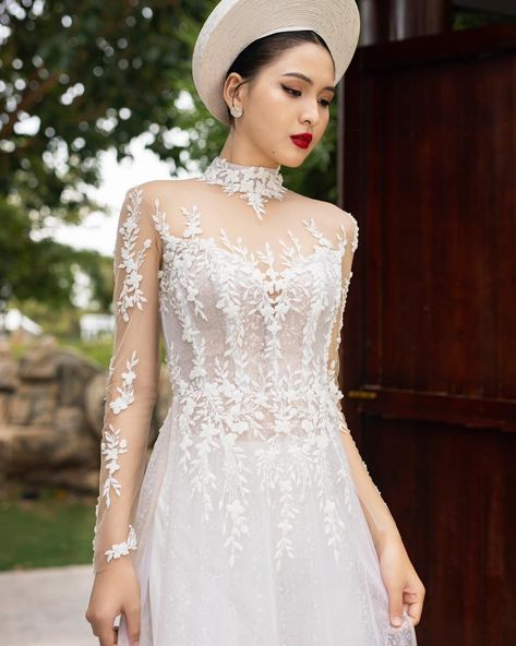 Introducing the Majori Áo Dài✨ Our stunning white bridal áo dài is the perfect fusion of tradition and elegance. Featuring intricate lace detailing and a figure-flattering silhouette, this gown is designed to make any bride feel both regal and romantic. The modern twist on the classic Vietnamese áo dài is ideal for those who wish to honor their heritage while embracing contemporary bridal fashion. Whether you're walking down the aisle or celebrating your special day, the Majori Áo Dài is sur... Ao Dai White, Bridal Ao Dai, Vietnamese Wedding Dress, Ao Dai Vietnamese, Modern Bridal Dress, Skirt Chiffon, Vietnamese Wedding, Contemporary Bridal, Chiffon Pants