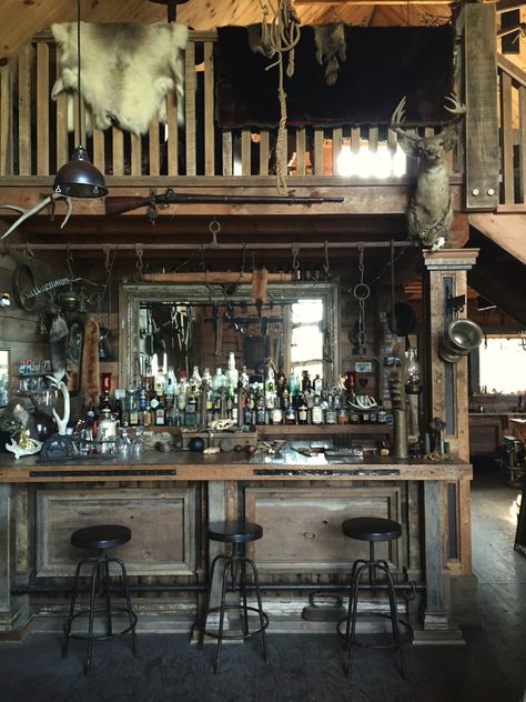 My families "Barn" that has a full western inspired bar, complete with an assortment of guns, antiques and taxidermy. Quentin Tarantino would love this property #thehatefuleight #antiques #saloon #canada #cabin #barn #countryliving #countryhome #loghome #taxidermy #loft #antiquebar #antiquedesign #westernstyle Old West Saloon Bar, Old Saloon Bar Ideas, Cowboy Saloon Bar, Old Saloon Bar, Old Saloon Aesthetic, Cowboy Bar Aesthetic, Western Cantina, Western Saloon Aesthetic, Western Bar Aesthetic