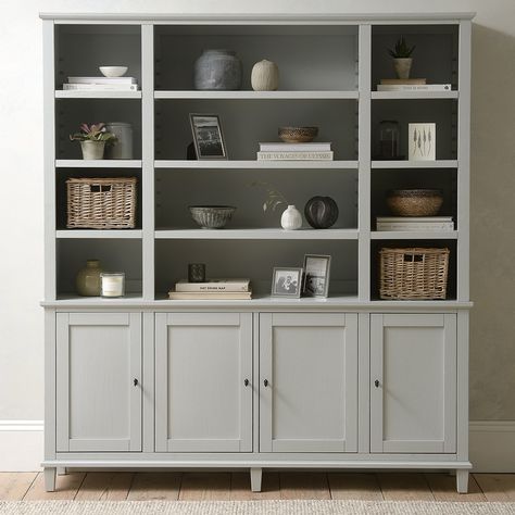 Finished with elegant tapered details, our Charlbury Mineral Grey grand bookcase offers ample space for displaying all your favourite ornaments. Featuring adjustable shelving, plus working locks and keys for the lower cupboards.A collection that values practicality and beauty in equal parts. Handcrafted using ash wood, a delicate natural grain runs throughout each piece, while a grey palette provides a fresh yet traditional feel. Made with family homes in mind, with extension drawer runners that Matching Bedroom Furniture, Grey Bookshelves, Beds Frames, Low Cupboard, King Size Beds, Grey Shelves, Large Bookcase, Grey Palette, Large Shelves