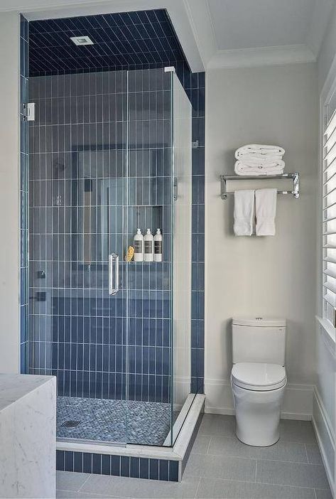 Blue Tiles | 43 Walk-In Shower Ideas To Upgrade Your Bathroom | Decoist Vertical Shower Tile, Blue Tile Wall, Blue Bathroom Tile, Shower Tiles, Frameless Glass Doors, Black Floor Tiles, Shower Wall Tile, Dark Blue Walls, Bathtub Tile