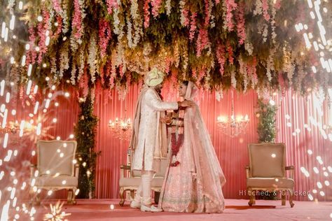 10 Amazing New Decor Colour Combinations We Spotted In Real Weddings | WedMeGood Jai Mala Stage, Jaimala Stage Decoration, Stage Wedding Decorations, Jaimala Stage, Saree For Haldi, Wedding Jaimala, Jai Mala, Marigold Wedding, Ruffled Saree