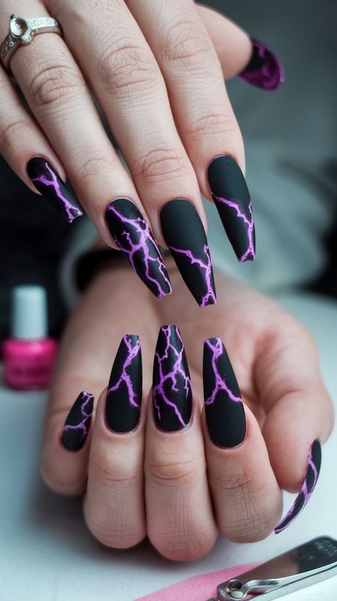 Get ready to shock with these edgy stiletto nails! Featuring a sleek black base paired with a mesmerizing purple lightning pattern, these nails bring an electrifying vibe to any outfit. Perfect for concerts, parties, or just because you want to shine!
#acrylicnails #nailsdesign #nailsinspo #octobernails Nails With Lightning, Black Nails With Lightning, Edgy Stiletto Nails, Nails For Rock Concert, Lightening Nail Designs, Nails Black And Purple, Storm Nails Design, Purple Lightning Nails, Lightning Nail Art