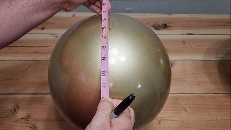 This festive season, we're diving into a fun and budget-friendly project using inflatable balls from your local dollar store or Dollar Tree. Let's get started on how to make giant jingle bells! Giant Jingle Bells, Jingle Bells Diy, Playground Balls, Getting Rid Of Mice, Gold Spray Paint, Black Acrylic Paint, Gold Spray, Beach Ball, Paint Marker