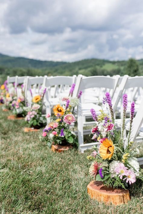 Wildflower Table Decor Wedding, Country Spring Wedding Colors, Wildflower And Eucalyptus Wedding, Wildflower Chair Decor, Summer Wild Flower Wedding, Pampas And Wildflower Wedding, Meadow Inspired Wedding, Wildflower Wedding Ceremony Aisle Decorations, Wild Flower Wedding Arbor