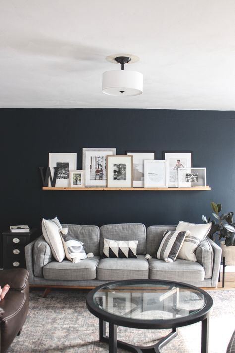 Living Room With Navy Walls, Living Room Designs Wall Color, Navy Grey And Wood Living Room, Living Room One Wall Painted, Grey Couch Blue Walls Living Room Ideas, Color To Paint Living Room Ideas, Navy Tv Room, Navy Living Room Accent Wall, Cozy Navy Living Room