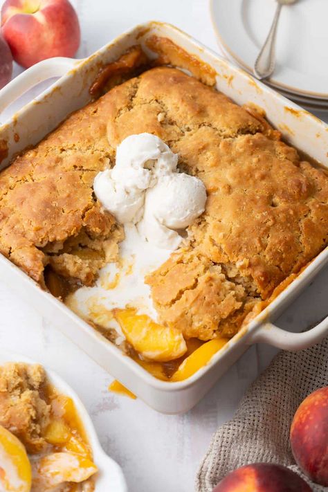 Satisfy your peach cravings with this delicious gluten-free peach cobbler. This easy recipe uses fresh peaches and brown sugar for a sweet filling and an old-fashioned buttery topping. Perfect for summer! It is my favorite gluten-free recipe with peaches. Recipe With Peaches, Gluten Free Cobbler, Peach Cobbler With Bisquick, Gluten Free Peach Cobbler, Peach Healthy, Gluten Free Christmas Recipes, Fresh Peach Recipes, King Arthur Gluten Free, Clean Desserts