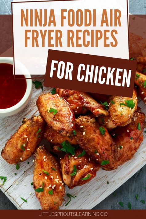 Air fried chicken wings with herbs and sesame seeds sprinkled on with sauce Ninja Foodi Xl 2 Basket Air Fryer Recipes, Air Fryer Recipes For Chicken, Garlic Wings Recipe, Chicken Dishes For Dinner, Autumn Foods, Ninja Cooking System Recipes, Recipes For Chicken, Air Fryer Chicken Tenders, Air Fried Food