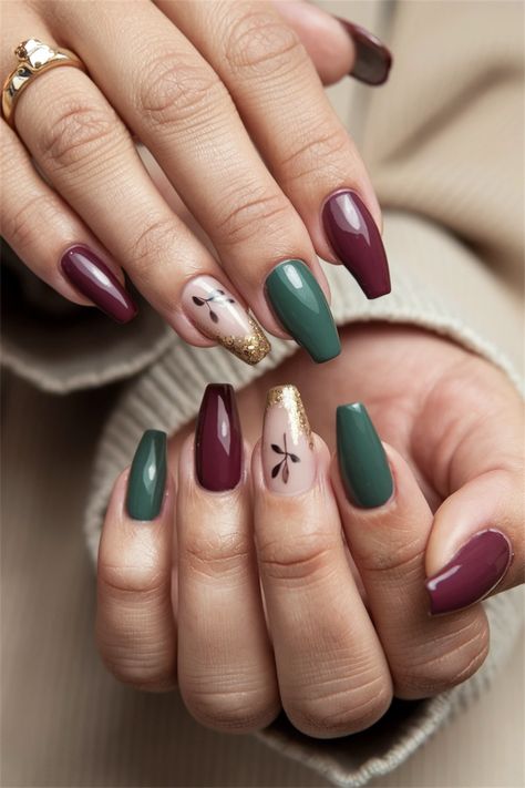 Embrace autumn with these gorgeous coffin fall nail ideas that perfectly capture the essence of the season. Imagine rich, warm hues like burnt orange and deep burgundy elegantly shaped into trendy coffin tips. Add accents of gold foil or delicate leaf motifs for that extra touch of seasonal charm. These nails will not only complement your cozy sweaters but also keep your style effortlessly chic this fall. Get inspired with #FallNailIdeas #CoffinNails #AutumnNails! Fall Nail Ideas Burgundy, Burgundy Leaf Nails, Green Nails With Gold Design, Fall Nails Green And Brown, Green And Burgundy Nails, Burgundy And Green Nails, Fall Nail Ideas Coffin, Autumn Nails Green, Autumn Green Nails