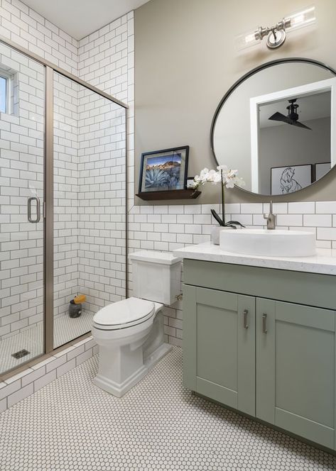 We love this clean and simple bathroom design with subway tile and geometric flooring! Subway Tile Bathroom Vanity, Tile Bathroom Vanity, Green Cabinets Bathroom, Subway Tile Bathroom, Bathroom Cabinet Colors, Charming Bathroom, Green Bathroom Vanity, Simple Bathroom Designs, Green Vanity