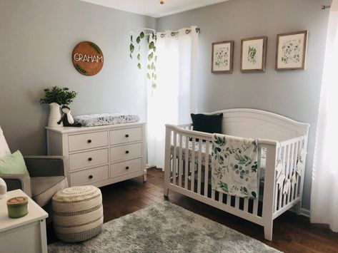 Love the use of botanicals in this green infused nursery Green And Blue Nursery Gender Neutral, Green Leaf Nursery, Nursery Plant Theme, Botanical Nursery Neutral, Grey Green Nursery, Grey Nursery Ideas Neutral, Plant Themed Baby Nursery, Green Themed Nursery, Plant Theme Nursery