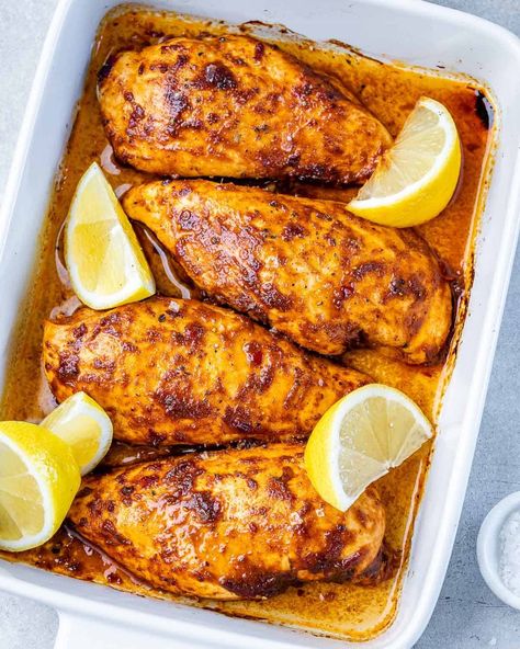 top view of 4 baked chicken breasts in harissa seasonings with 4 lemon garnishes in a white baking dish Baked Chicken Breasts, Crispy Sweet Potato Fries, Juicy Baked Chicken, Harissa Chicken, Crispy Sweet Potato, Healthy Fitness Meals, Chicken Breast Seasoning, Citrus Chicken, Marinade Recipes