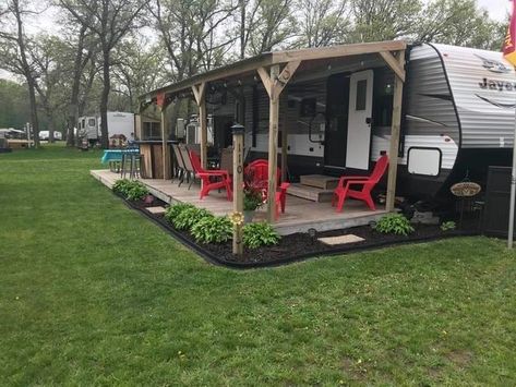 Outside Of Camper Ideas, Landscape Ideas Around Camper, Deck On Camper, Camp Porch Ideas, Diy Rv Patio Ideas, Camper Permanent Site, Camper Patio Ideas Campsite, Diy Rv Porch, Seasonal Camping Sites Landscaping