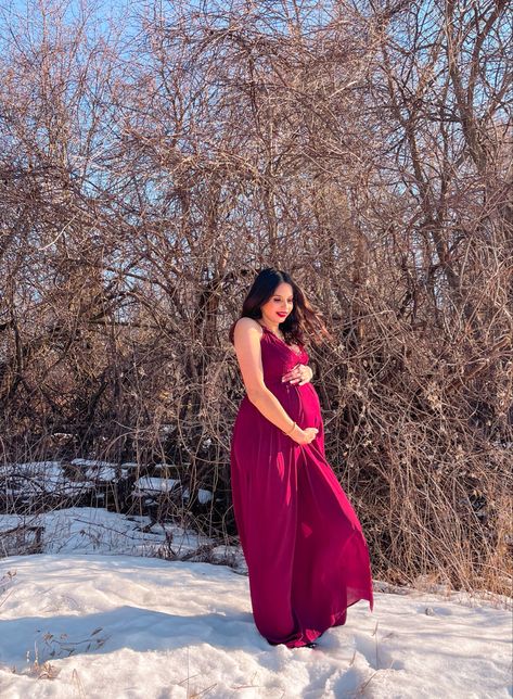 Winter maternity photoshoot in snow wearing maroon flowy dress Photoshoot In Snow, Winter Maternity Photoshoot, Winter Maternity, Maternity Photoshoot, Pregnancy Photoshoot, Flowy Dress, Maternity Photography, Red Formal Dress, Photography Inspiration