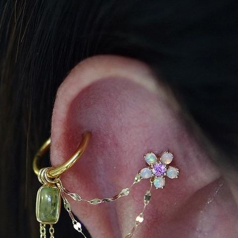 B  •  Piercing Stylist on Instagram: "The loveliest cherry blossom by @bvla and a peridot charm by @modernmoodbodyjewelry that reminds me of a leaf. This new look simply makes me smile. How about you?   Before C moved to North America, we did these piercings  at @piercingday_. During this visit, we overhauled her styling. So good to see her again!  #flatpiercing #helixpiercing #piercinginspiration #piercingjewelry #flowerjewelry #piercinglove #earstyling #piercedwomen" Cat Flap Piercing, Flat Piercing, Cat Flap, Piercing Jewellery, Helix Piercing, Flower Jewellery, Piercing Jewelry, Make Me Smile, Cherry Blossom