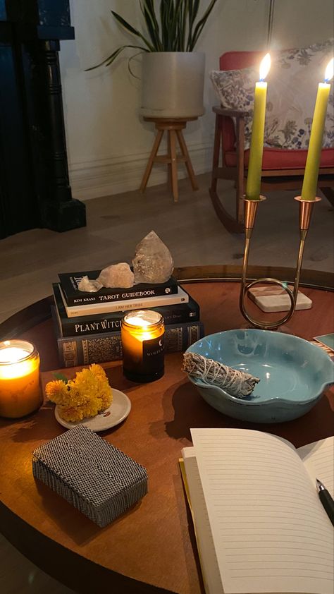 A table with a yellow flower, journal and pen, tarot deck, candles and sage or smudge stick for cleansing in cozy living room. Abundant Life Aesthetic, Vision Board Abundance, Abundant Aesthetic, Abundance Aesthetic, Spring Character, I Am Abundant, Abundance Images, Manifesting 2024, Mind Movie