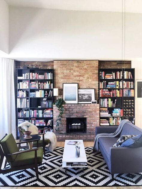 Bookshelves + exposed brick + fireplace Brick Fireplace With Bookshelves, Fireplace With Bookshelves, Wood Stove Fireplace Insert, Exposed Brick Fireplace, Exposed Brick Fireplaces, Types Of Bricks, Fireplace Bookshelves, Rustic Brick, Wood Stove Fireplace