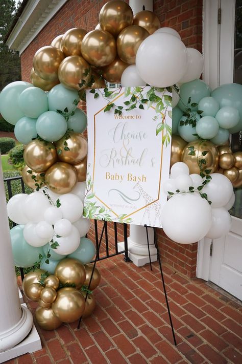 Safari-inspired #babybash with mint green, gold and white color scheme. With ceiling balloon install. #babyshower #balloongarland Mint Green And Gold Wedding Theme, Mint Green Balloons Decor, Wedding Decorations Mint Green, Mint Green And Gold Birthday Party Decor, Aka Balloon Decor, Mint Green Decorations Party, Mint Green Baby Shower Ideas, Mint Green Birthday Decorations, Mint Party Decorations