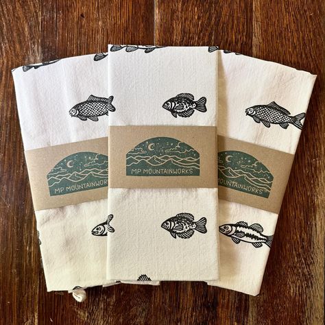 a few recent additions to the shop! Fish tea towels, fish trio block prints, & peony block prints embellished with watercolor | #blockprinting #printmaking #printmaker #handmade #natureart #fishart #ctart #ctartists #connecticutbusiness #ctsmallbusiness #makerswithmoxie Fish Decor Ideas, Fish Decor, Fish Home, Art Fish, Hand Carved Stamps, Printed Tea Towel, Brown Trout, Ideas Handmade, Largemouth Bass